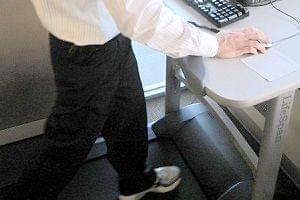 Carle Spokesman Sean Williams works out on the treadmill in his department.