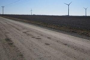 Wind turbines operate on rural road near Paxton