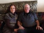 Heagin and Roger Burton sitting together on a couch