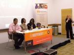 Members of the panel at the Community Cinema screening at a table in the Champaign Public Library