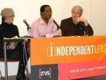 Panelists sitting at a table at the film screening