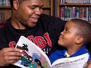 Shony Coleman reading to his son