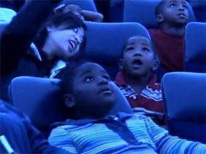 Head Start children look up to view planetarium show