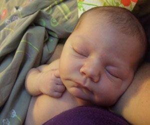 Baby lying in a crib