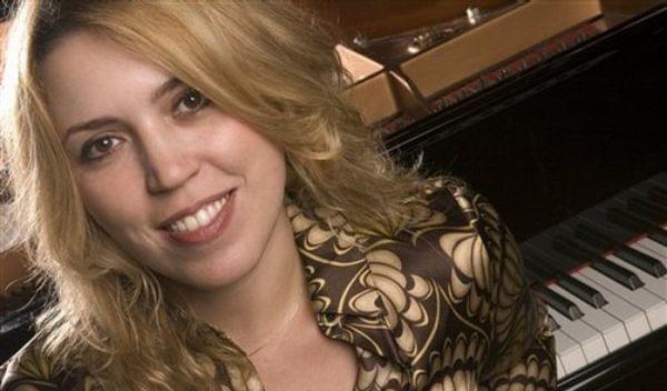 Gabriela Montero in front of piano