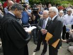 Cook County Chief Judge Tim Evans, left, presides over the civil union of James Darby, center, and Patrick Bova during ceremonies in Chicago's Millennium Park Thursday, June 2, 2011 in Chicago. 