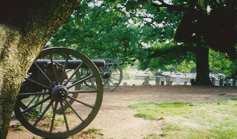 Cannons at Gettysburg with grave markers in background