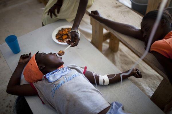 Child getting treatment for cholera in Haiti.