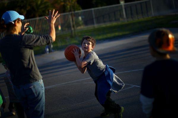 Kid playing basketball