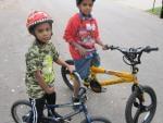 Mark Smith, 7, and his brother Tauryon Smith, 11, pose next to their bicycles in Champaign.