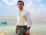 Mohamed Nasheed, the first democratically elected president of the Republic of Maldives, standing on the shore