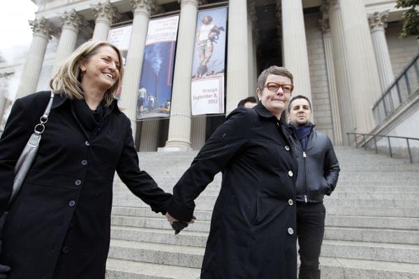 Sandy Stier, left, and Kris Perry of Berkeley, Calif., arrive at the National Archives in Washington, Monday, March 25, 2013, to view the U.S. Constitution, a day before their same-sex marriage case is argued before the Supreme Court.
