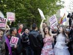 Pro gay marriage activists celebrate after French lawmakers legalized same-sex marriage, Tuesday, April 23, 2013 in Paris.