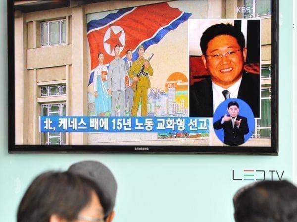 Passersby watch a local television broadcast in Seoul on Thursday showing a report on the sentencing of Kenneth Bae.