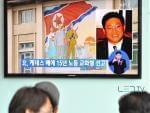 Passersby watch a local television broadcast in Seoul on Thursday showing a report on the sentencing of Kenneth Bae.