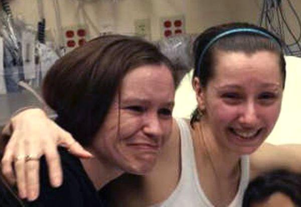 Amber Berry hugs her sister Beth Serrano