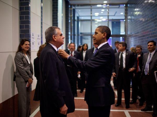 President Barack Obama fixes the tie of Transportation Secretary Ray LaHood