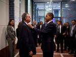 President Barack Obama fixes the tie of Transportation Secretary Ray LaHood
