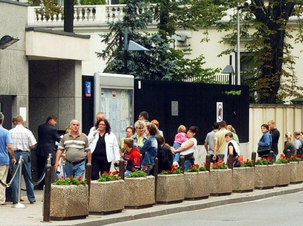 Poles line up in front of the Visa Section of the U.S. Embassy in Warsaw, Poland, Tuesday, Aug. 14, 2007.