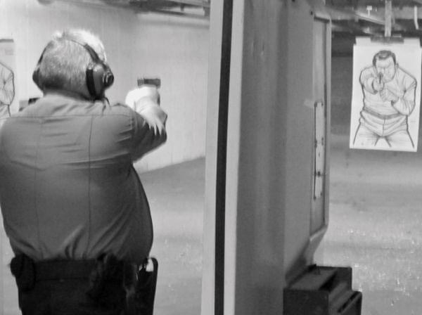 Frank Whitmore takes aim during a “live fire” exercise