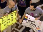 Supporters of Illinois' gay marriage legislation hold hands and sing songs in the rotunda at the Illinois State Capitol Friday, May 31, 2013, in Springfield, Ill.