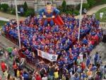 Superman fans stand to try to break the world record for most people dressed as Superman in Metropolis, Illinois.