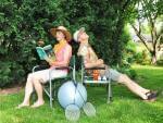 a couple sits in their backyard