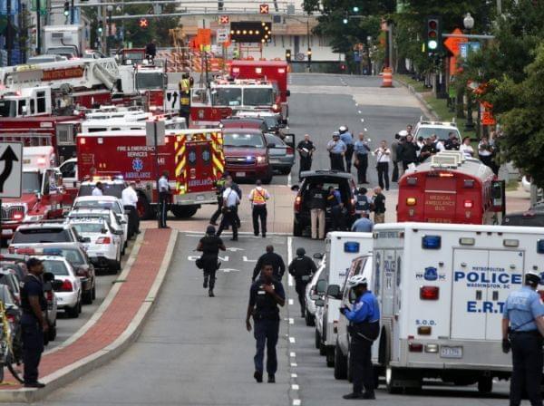 Emergency vehicles and law enforcement personnel respond to a reported shooting at an entrance to the Washington Navy Yard on Monday in Washington, D.C. Several people were shot with the shooter still possibly active.