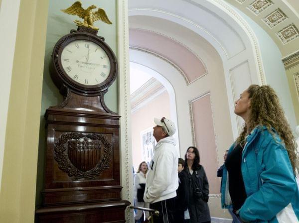 Still Right Twice A Day: Visitors look at the Ohio Clock outside the Senate chamber on Capitol Hill Sunday. The clock that has stood watch over the Senate for 196 years stopped running shortly after noon Wednesday. Employees who wind the clock weekly