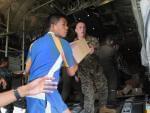 Military personnel from the U.S. and the Philippines unload relief goods at the Tacloban airport, Nov. 11, 2013. Some reports estimate that 10,000 people may have died in the city of Tacloban.