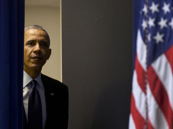 President Obama walks into an auditorium in the Eisenhower Executive Office Building Monday for a speech about World AIDS Day.