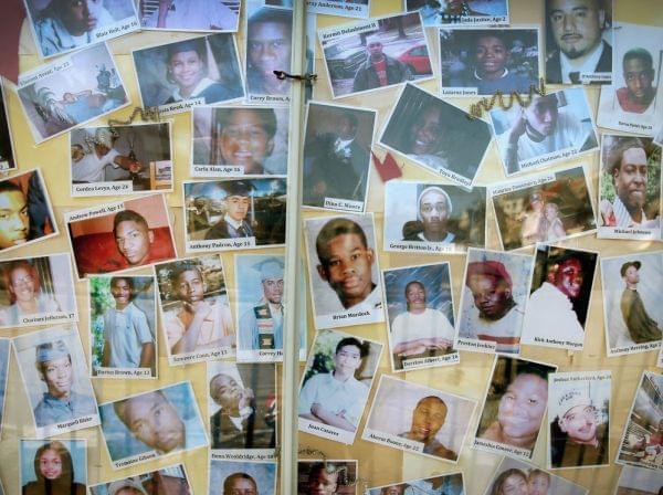 Pictures of Chicago residents who have died by gunfire are posted on the city's South Side.