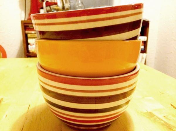 A stack of bowls on a kitchen table.