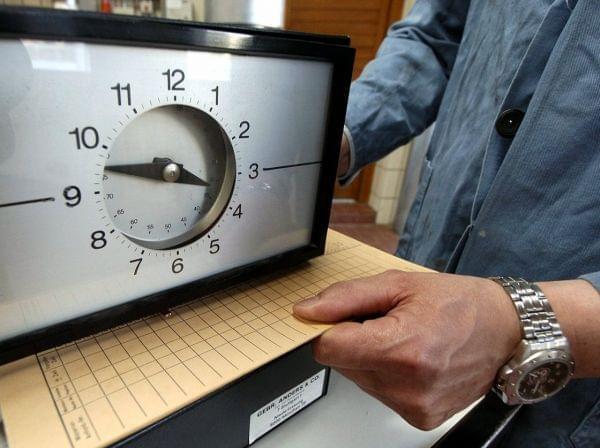 Punching a time card: It's still one way of tracking hours worked. President Obama believes more workers need to be able to add overtime to their pay.