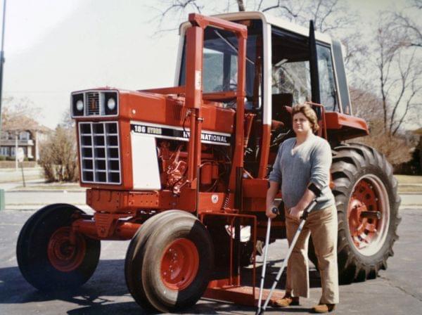 Chip Petrea stands near a modified tractor after his accident.