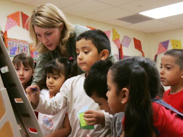 Denise Wiktor works with preschool students at the Shiloh School in downtown Waukegan, Ill., Tuesday, April 18, 2006.