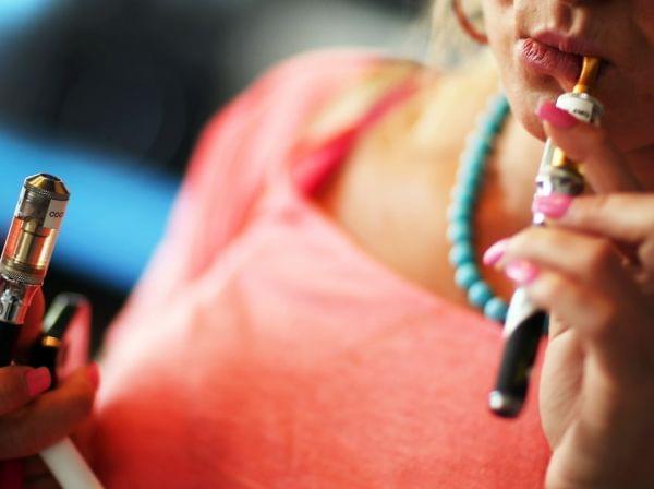 A woman tries electronic cigarettes at a store in Miami.