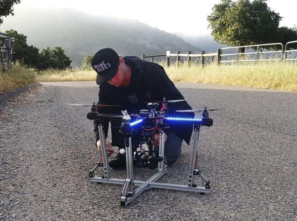 Jeff Blank, of Los Angeles-based Drone Dudes, prepares a quadcopter for takeoff. The drone has to chase a motorcycle down a hill.