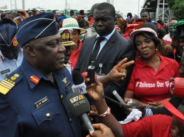 Nigeria's chief of defense staff Air Marshal Alex S. Badeh speaks during a demonstration in Abuja calling for the rescue of girls kidnapped from their school in Chibok. Badeh says the government knows where the girls are — but that a rescu