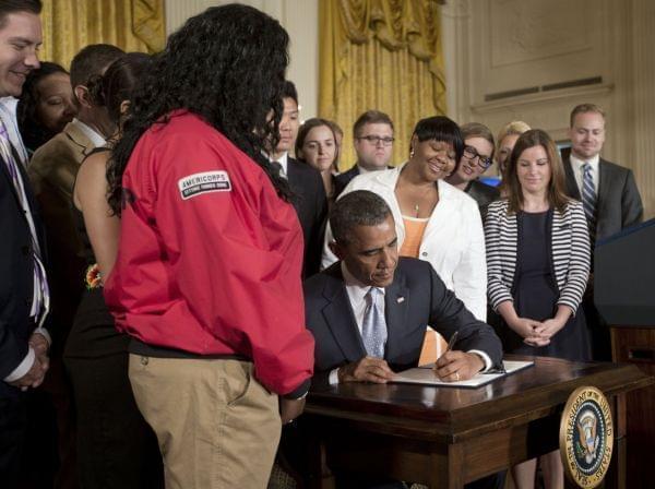 President Obama is introduced by Andy MacCracken, before signing a Presidential Memorandum on reducing the burden of student loan debt on Monday in East Room of the White House.