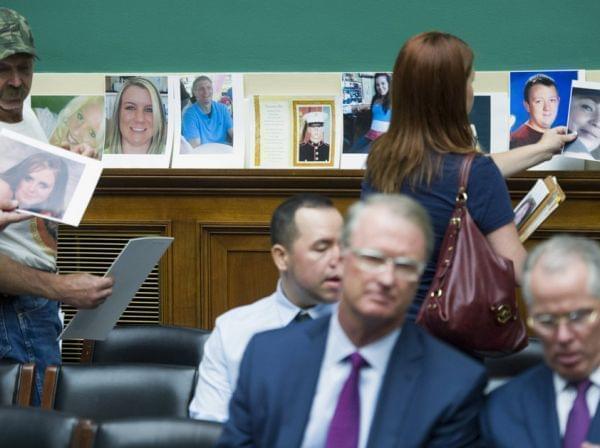 Family members of victims of a faulty GM ignition switch lined the rear wall of a congressional hearing with their photos Wednesday.