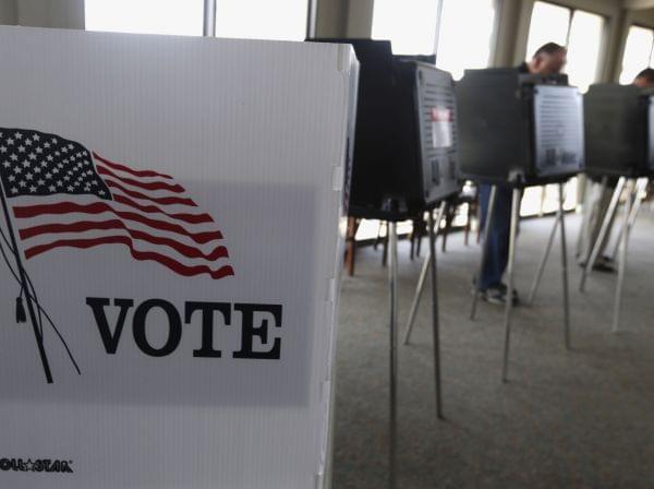 In this March 18, 2014 file photo, voters cast their ballots in the Illinois primary in Hinsdale, Ill.
