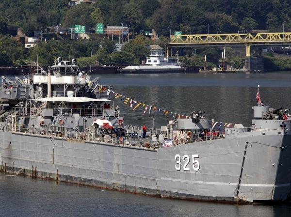 The LST 325, a World War II-era ship that ferried troops to the beaches of Normandy during D-Day, moves up the Allegheny River, preparing to dock in Pittsburgh on Wednesday, Sept. 1, 2010. The craft is crewed by volunteers and veterans who want to te