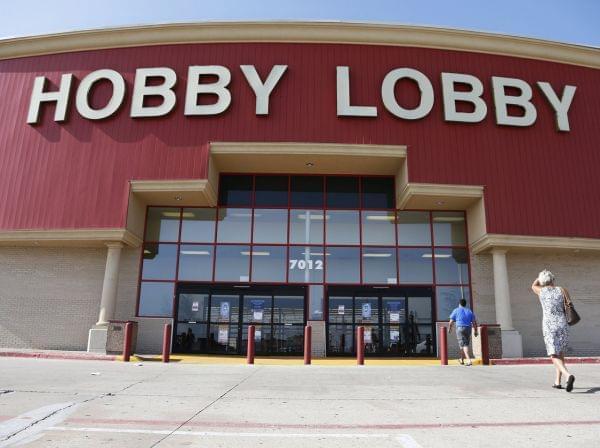 Customers walk into a Hobby Lobby store in Oklahoma City on Monday.