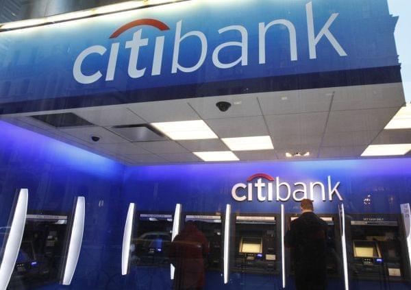 In this Jan. 6, 2012 photo, a Citibank customer makes a transaction at an ATM, in New York.