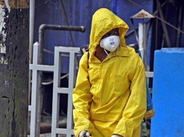 Monrovia City Corporation employee sprays disinfectant