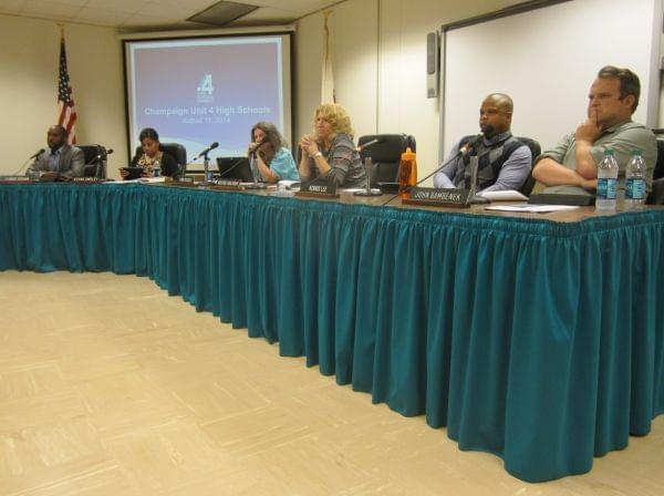 Members of the Champaign Unit Four School Board, seated during the Monday, August 11th meeting, in which a high school bond referendum was approved to go on the November ballot.