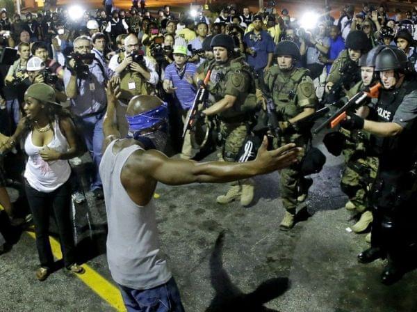 Police arrest a man on Aug. 9th in Ferguson, Mo.