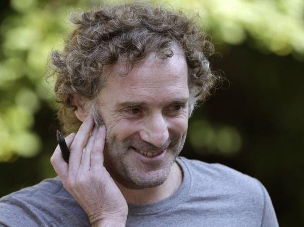 Peter Theo Curtis talks with reporters outside his mother's home in Cambridge, MA.