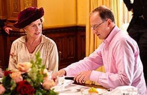 Alistair Bruce and Penelope Wilton (Isobel Crawley) discuss proper dining protocol. 